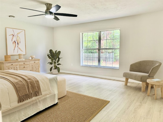 607 NE 10th Blvd, Williston, FL 32696 - bedroom with light wood finished floors and ceiling fan