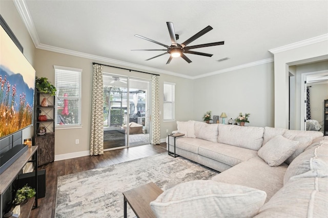 living room featuring ceiling fan, crown molding, dark wood finished floors, and baseboards
