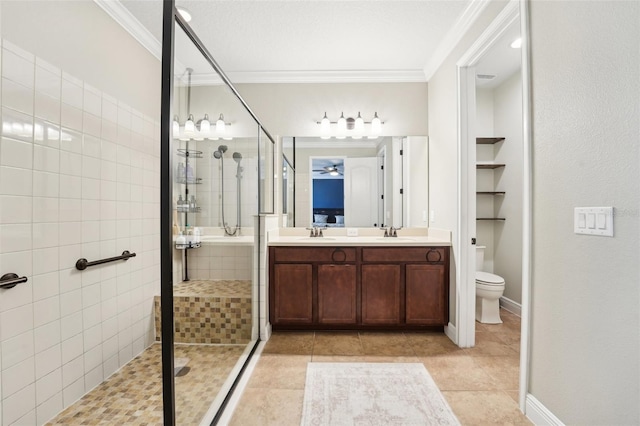 full bath with a stall shower, crown molding, tile patterned floors, toilet, and double vanity