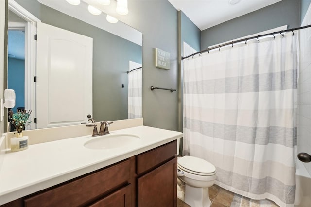 bathroom with vanity, toilet, and a shower with shower curtain