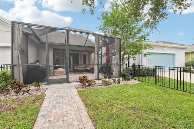 back of house featuring a patio area, an attached garage, stucco siding, a lanai, and an outdoor hangout area