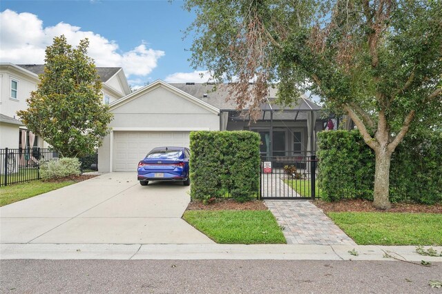 view of front of home with fence, an attached garage, concrete driveway, stucco siding, and a lanai