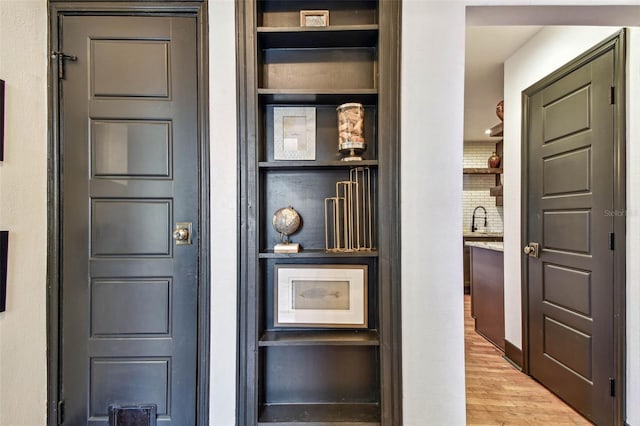 233 24th St N, Saint Petersburg, FL 33713 - detailed view of a sink, wood finished floors, and built in shelves