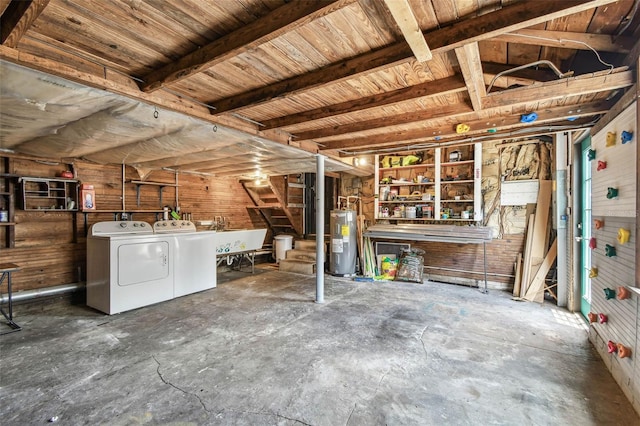 233 24th St N, Saint Petersburg, FL 33713 - basement with water heater, independent washer and dryer, stairs, and wood walls