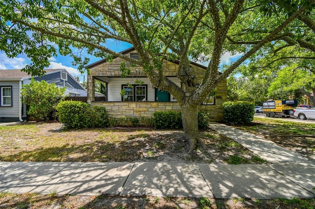 233 24th St N, Saint Petersburg, FL 33713 - view of front facade featuring stone siding