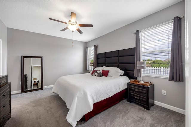 bedroom featuring carpet, baseboards, and a ceiling fan