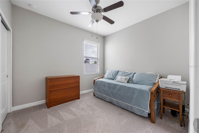 bedroom with carpet, baseboards, a closet, and ceiling fan