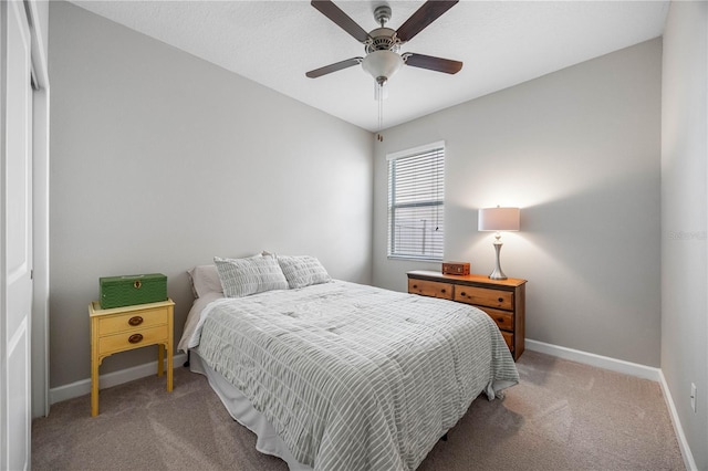 bedroom with carpet, baseboards, and ceiling fan