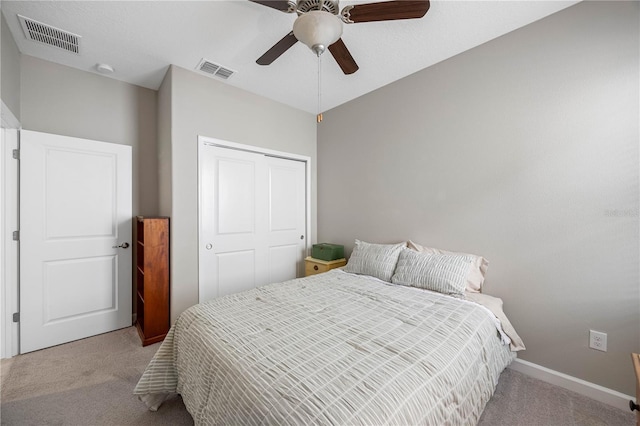 bedroom with carpet floors, a closet, ceiling fan, and baseboards