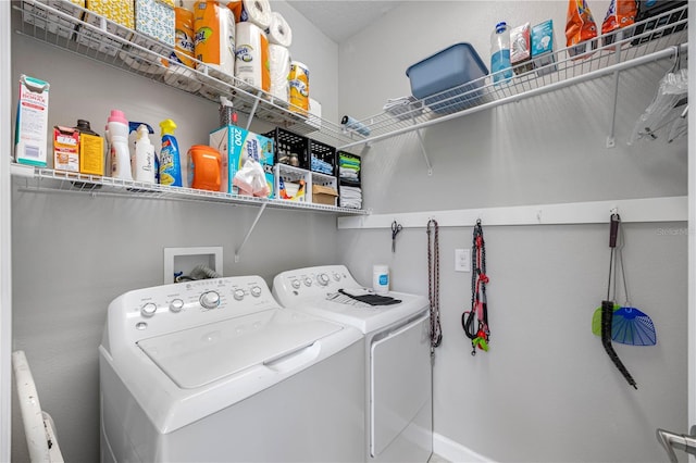laundry room featuring washer and clothes dryer
