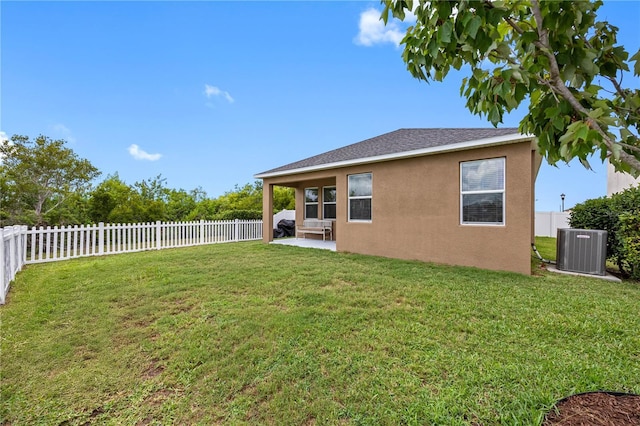 view of yard featuring cooling unit and a patio