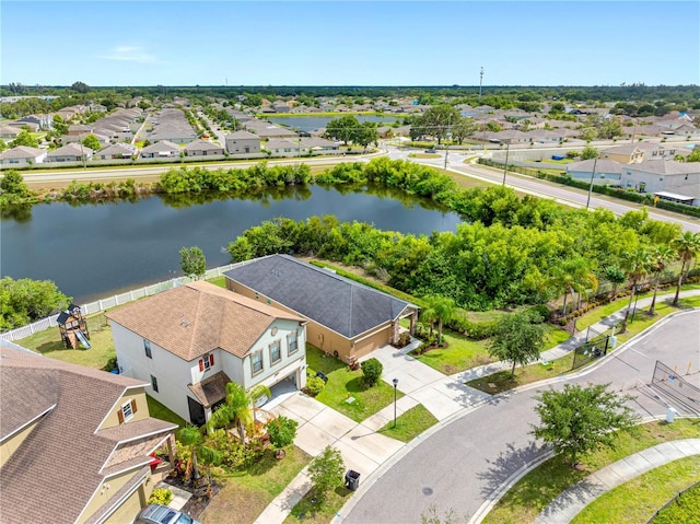 aerial view of residential area with a large body of water