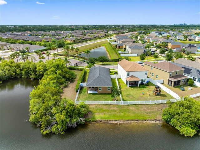 aerial perspective of suburban area with a nearby body of water