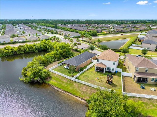 aerial view of residential area with a large body of water