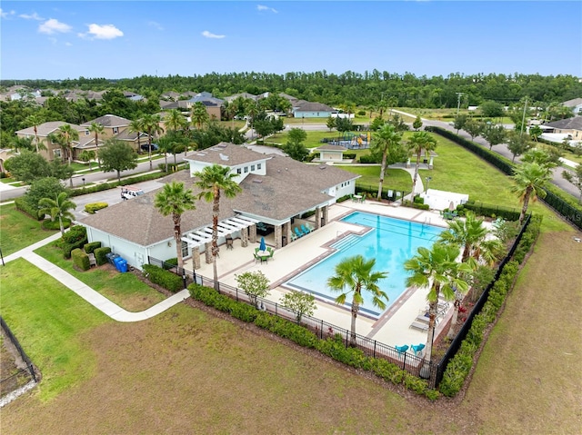 aerial perspective of suburban area featuring a pool area