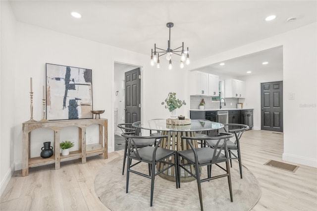 7 Hamilton Heath Dr, Tampa, FL 33604 - dining room with a chandelier, baseboards, light wood-style floors, and recessed lighting