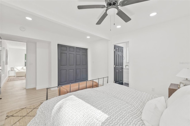 7 Hamilton Heath Dr, Tampa, FL 33604 - bedroom featuring a closet, recessed lighting, light wood finished floors, ceiling fan, and ensuite bath
