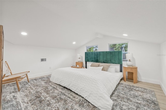 7 Hamilton Heath Dr, Tampa, FL 33604 - bedroom featuring light wood-style flooring, vaulted ceiling, baseboards, and recessed lighting