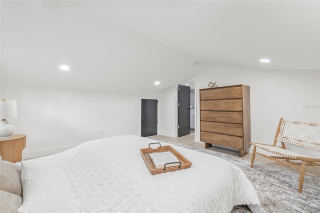 7 Hamilton Heath Dr, Tampa, FL 33604 - bedroom featuring baseboards, recessed lighting, lofted ceiling, and light wood-style flooring