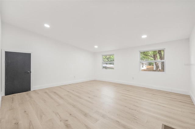 7 Hamilton Heath Dr, Tampa, FL 33604 - empty room with light wood-style flooring, recessed lighting, and baseboards