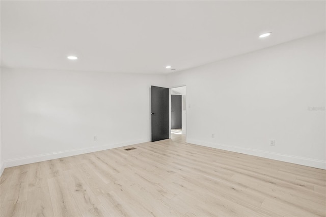 7 Hamilton Heath Dr, Tampa, FL 33604 - spare room featuring light wood-style flooring, recessed lighting, and baseboards