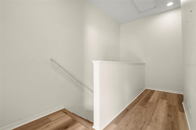 568 Shoreham Ct NE, Saint Petersburg, FL 33716 - hallway with an upstairs landing, light wood finished floors, baseboards, and recessed lighting