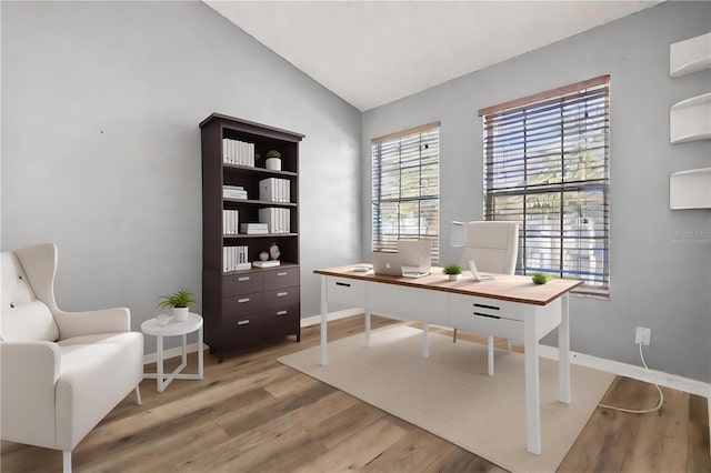 568 Shoreham Ct NE, Saint Petersburg, FL 33716 - home office with light wood finished floors, baseboards, and lofted ceiling
