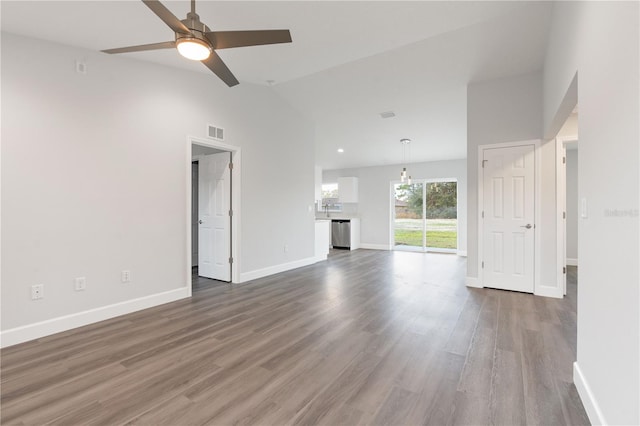 2680 SW 144th Ct, Ocala, FL 34481 - unfurnished living room with baseboards, a ceiling fan, wood finished floors, and high vaulted ceiling
