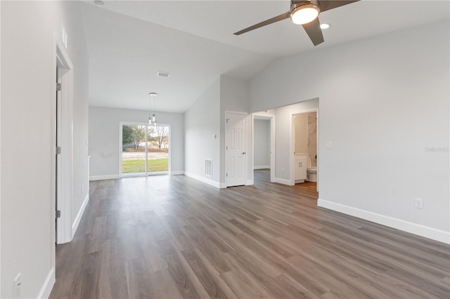 2680 SW 144th Ct, Ocala, FL 34481 - unfurnished living room with lofted ceiling, ceiling fan, wood finished floors, baseboards, and a chandelier
