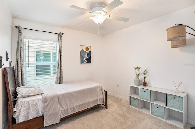 bedroom featuring carpet, baseboards, and ceiling fan