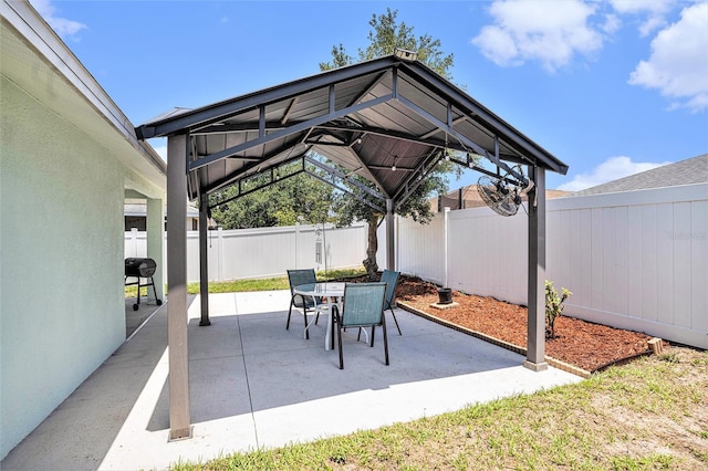 view of patio with a gazebo and a fenced backyard