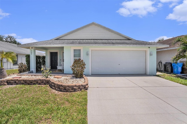 ranch-style home featuring concrete driveway, an attached garage, a front lawn, stucco siding, and roof with shingles