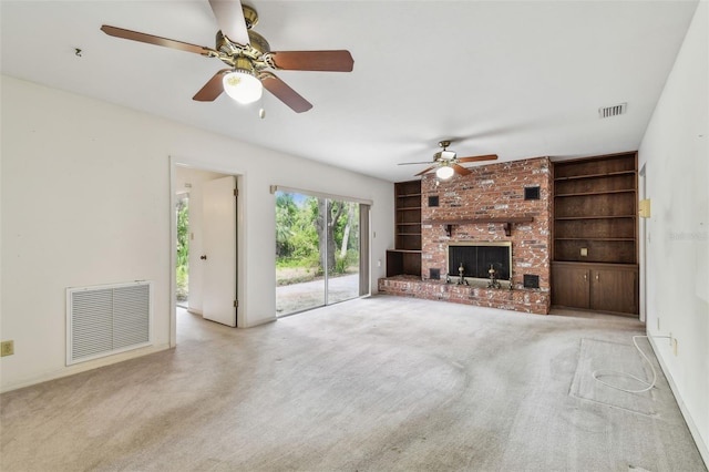 unfurnished living room featuring a ceiling fan, a brick fireplace, built in features, and carpet floors