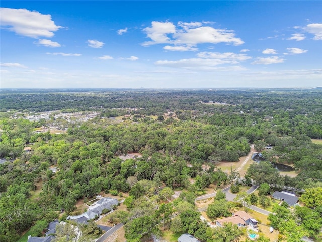 aerial overview of property's location featuring a forest