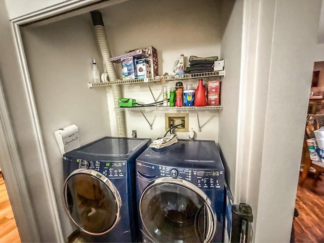 35058 Whispering Oaks Blvd, Dade City, FL 33523 - washroom with washer and dryer, wood finished floors, and bar