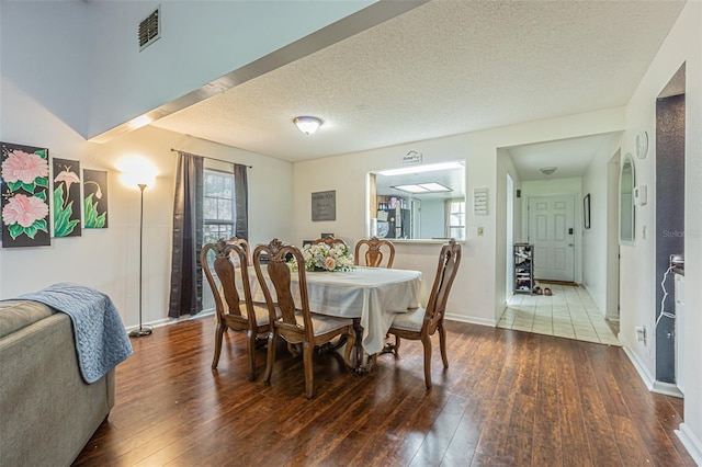 35058 Whispering Oaks Blvd, Dade City, FL 33523 - dining space featuring hardwood / wood-style floors, a textured ceiling, and baseboards