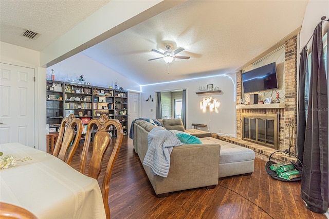 35058 Whispering Oaks Blvd, Dade City, FL 33523 - living area with a textured ceiling, a fireplace, hardwood / wood-style floors, a ceiling fan, and vaulted ceiling