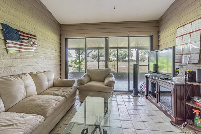 35058 Whispering Oaks Blvd, Dade City, FL 33523 - living area featuring wooden walls, plenty of natural light, lofted ceiling, and tile patterned flooring