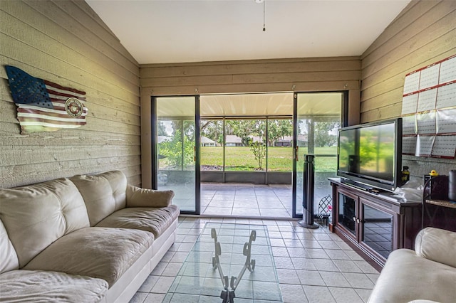 35058 Whispering Oaks Blvd, Dade City, FL 33523 - living area with wooden walls, vaulted ceiling, and tile patterned floors