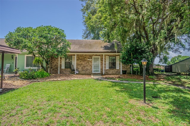 35058 Whispering Oaks Blvd, Dade City, FL 33523 - single story home featuring a front lawn and brick siding