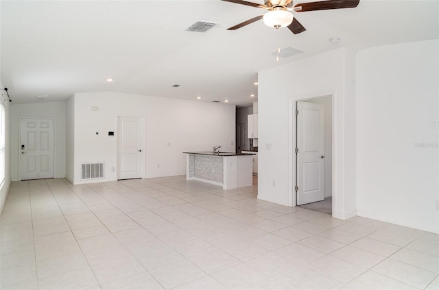 unfurnished living room featuring a ceiling fan, recessed lighting, and light tile patterned flooring