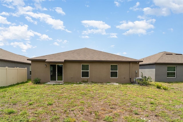 rear view of property with stucco siding