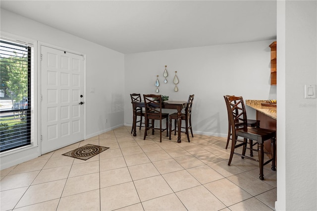 108 Biscayne Ave Unit B, Tampa, FL 33606 - dining area featuring light tile patterned floors and baseboards