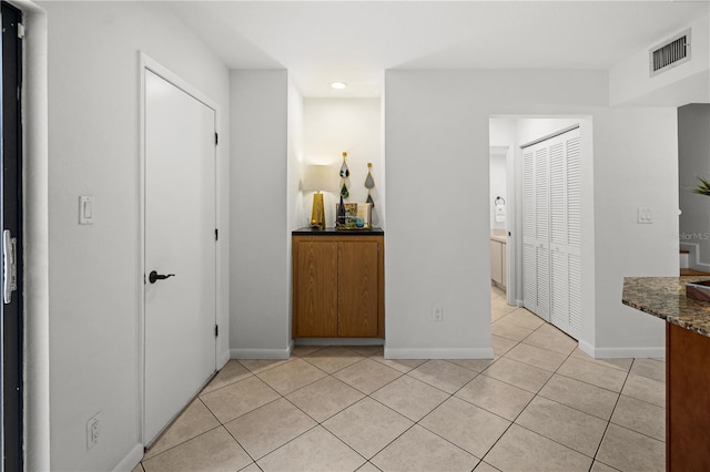 108 Biscayne Ave Unit B, Tampa, FL 33606 - hall featuring light tile patterned floors, baseboards, and recessed lighting
