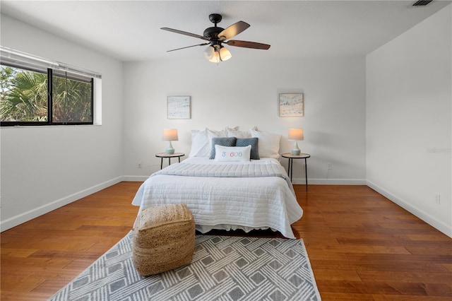 108 Biscayne Ave Unit B, Tampa, FL 33606 - bedroom with baseboards, wood finished floors, and a ceiling fan