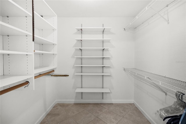 108 Biscayne Ave Unit B, Tampa, FL 33606 - walk in closet featuring tile patterned floors