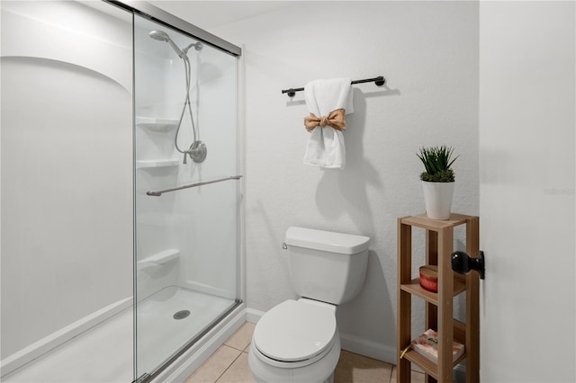 108 Biscayne Ave Unit B, Tampa, FL 33606 - bathroom featuring a shower stall, toilet, tile patterned floors, and baseboards