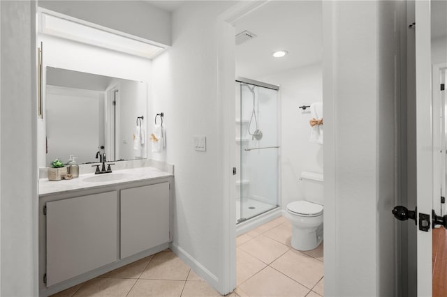 108 Biscayne Ave Unit B, Tampa, FL 33606 - bathroom with tile patterned floors, a stall shower, toilet, vanity, and baseboards