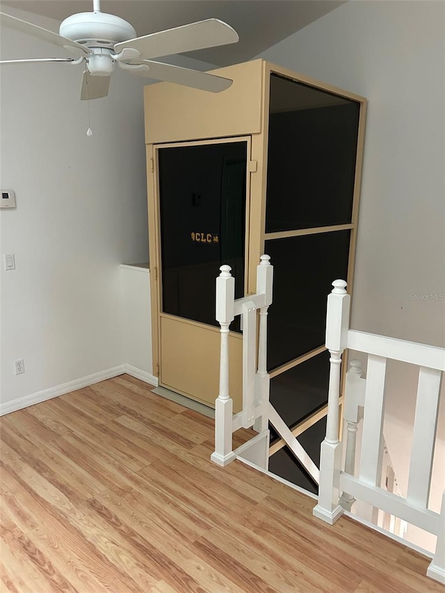 3145 Meta Ct, Largo, FL 33771 - empty room with ceiling fan, wood finished floors, and baseboards