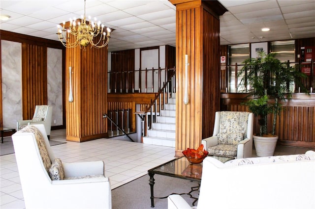 lobby featuring a drop ceiling, stairway, and recessed lighting